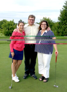 The three finalists of the putting contest. After several rounds, Buckland emerged the winner! Pictured L to R: Alyssa Kowcz, Unilever; George Buckland; Heather Gambose, MicroCare.